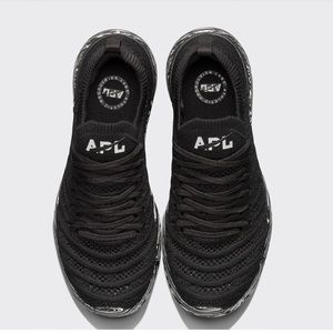 Women's TechLoom Wave APL black on white and black marble rubber sole.